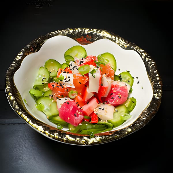 A colorful Japanese poke bowl with tuna, salmon, crab, cucumber, and sesame seeds.